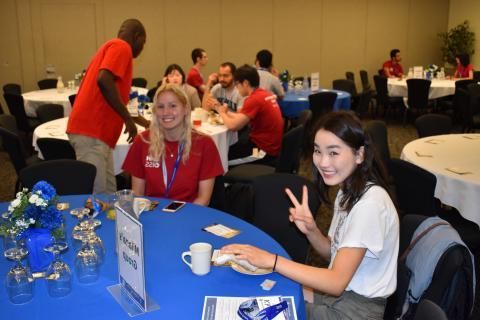 international students sitting at a round table